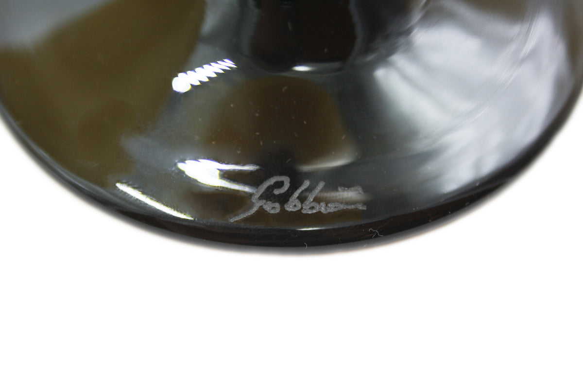 Yellow and black martini glass